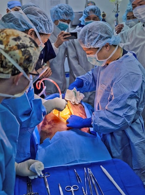 YOKOSUKA, Japan (March 11, 2026) — U.S. Naval Hospital (USNH) Yokosuka and Japan Self-Defense Force (JSDF) Hospital Yokosuka medical personnel conduct simulated surgical procedures using a “cut suit” training system during a bilateral mass casualty drill at USNH Yokosuka. The wearable simulator replicates complex trauma injuries, allowing teams to practice incision, hemorrhage control, and coordinated surgical response in a realistic environment. USNH Yokosuka and JSDF Hospital Yokosuka conducted the drill to enhance joint medical response capabilities and lifesaving procedures in support of a free and open Indo-Pacific. (U.S. Navy photo by Daniel Taylor/U.S. Naval Hospital Yokosuka Public Affairs)