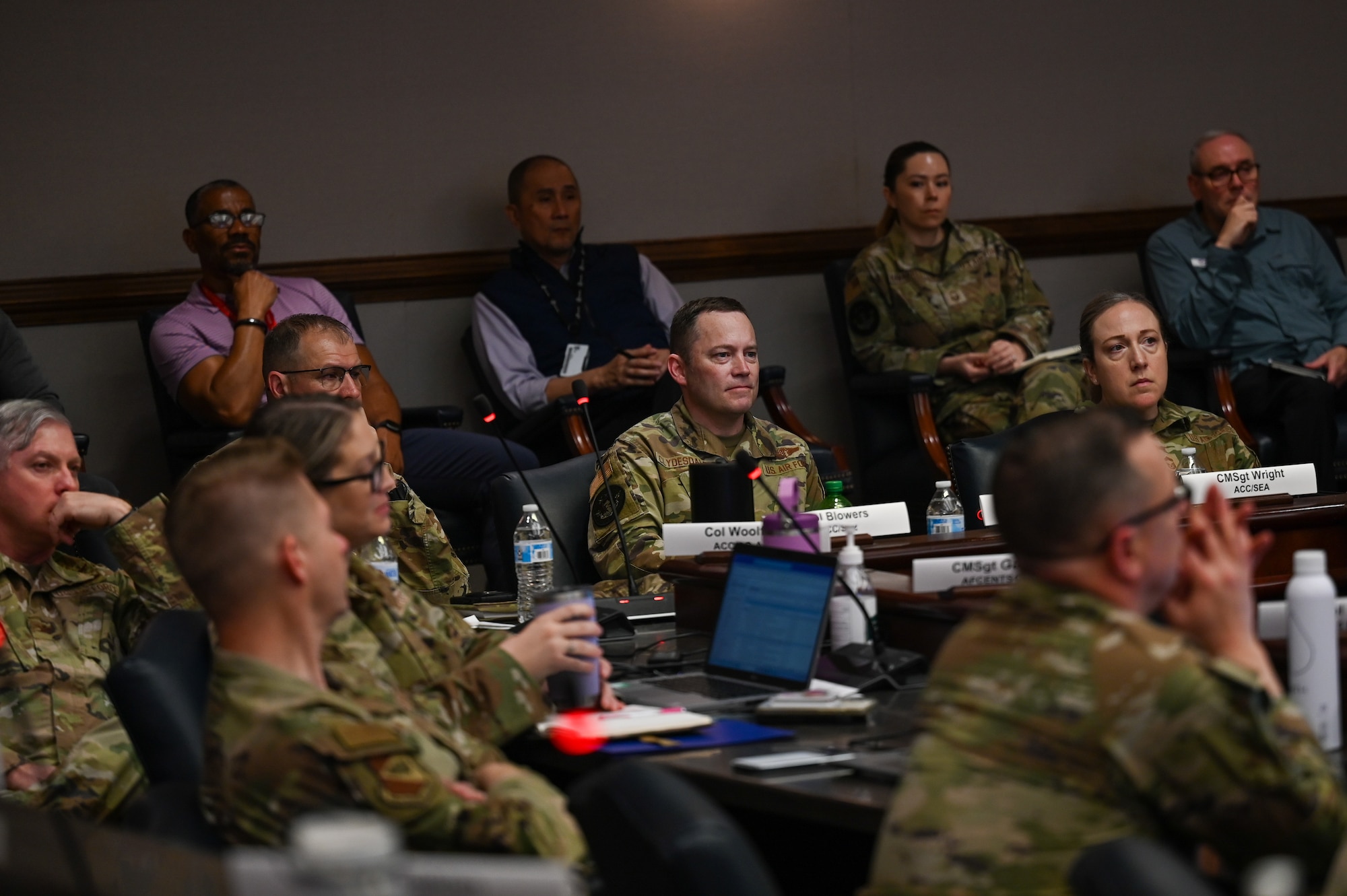 U.S. Air Force Col. Raymond Clydesdale, command surgeon for Air Combat Command, listens to a briefer during the ACC Command Surgeon Conference at Joint Base Langley-Eustis, Virginia, March 31, 2026. Discussions centered on new warfighting concepts, including the agile "Role 1" medical model and the strategic realignment under Air Force Medical Command. (U.S. Air Force photo by Marcus Bullock)