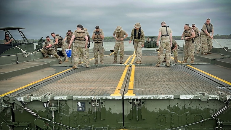 U.S. Army Reserve Soldiers from the 401st Engineer Company conduct multi-role bridging training operations at Bardwell Lake in Texas. The exercise focuses on wet gap crossing techniques, including ribbon bridge and raft operations, enabling the transport of vehicles, equipment, and personnel across water obstacles. The training integrates new Soldiers fresh from Advanced Individual Training (AIT) alongside experienced Noncommissioned Officers, enhancing readiness, morale, and technical proficiency. Conducted in partnership with the U.S. Army Corps of Engineers (USACE), the field training exercise highlights the importance of interagency collaboration and access to USACE-managed resources for realistic, mission-essential training environments.