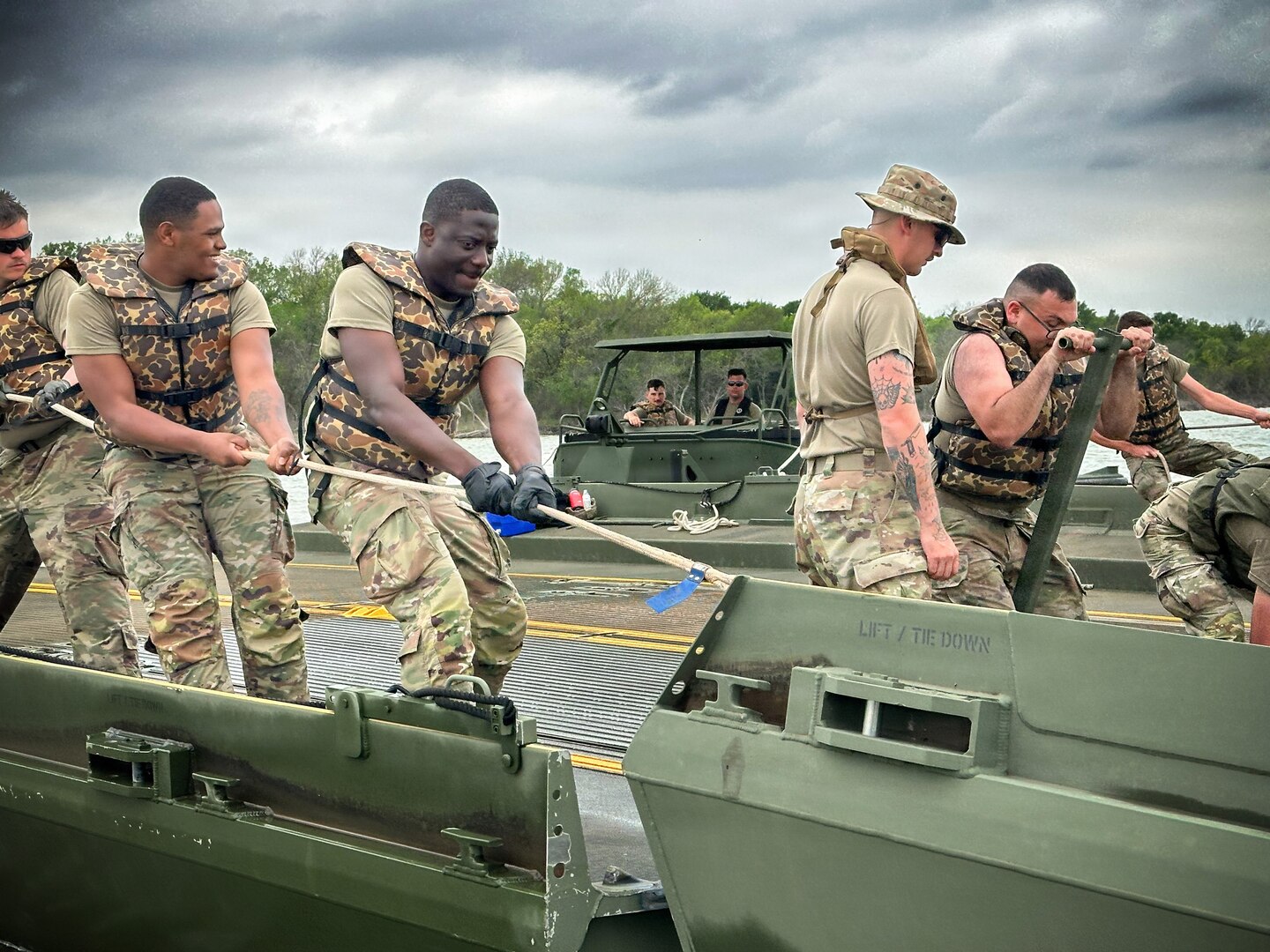 U.S. Army Reserve Soldiers from the 401st Engineer Company conduct multi-role bridging training operations at Bardwell Lake in Texas. The exercise focuses on wet gap crossing techniques, including ribbon bridge and raft operations, enabling the transport of vehicles, equipment, and personnel across water obstacles. The training integrates new Soldiers fresh from Advanced Individual Training (AIT) alongside experienced Noncommissioned Officers, enhancing readiness, morale, and technical proficiency. Conducted in partnership with the U.S. Army Corps of Engineers (USACE), the field training exercise highlights the importance of interagency collaboration and access to USACE-managed resources for realistic, mission-essential training environments.