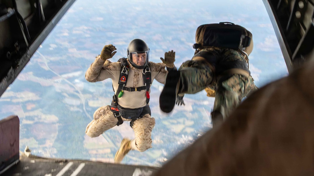 U.S. Marines with Maritime Raid Force, 24th Marine Expeditionary Unit, jump off the ramp of an aircraft while conducting a free-fall jump Maxton, North Carolina, April 7, 2026. The training was conducted to rehearse aerial insertion tactics over difficult terrain to support expeditionary operations. (U.S. Marine Corps photo by Daniel R. Garcia)