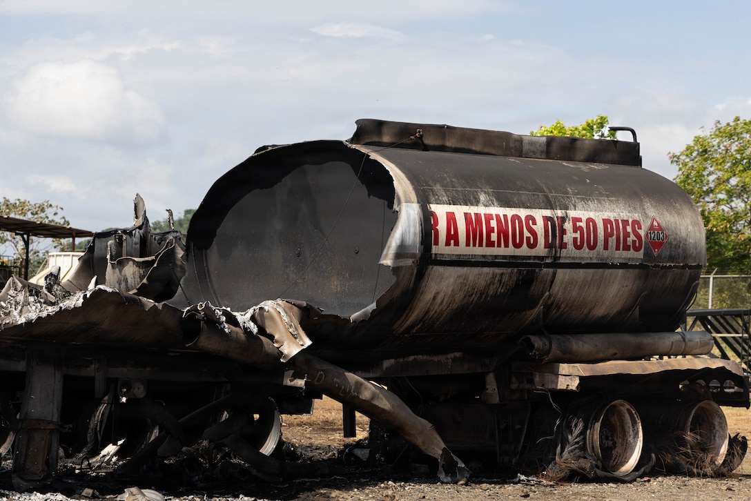 Charred debris and damaged equipment from a tanker explosion.