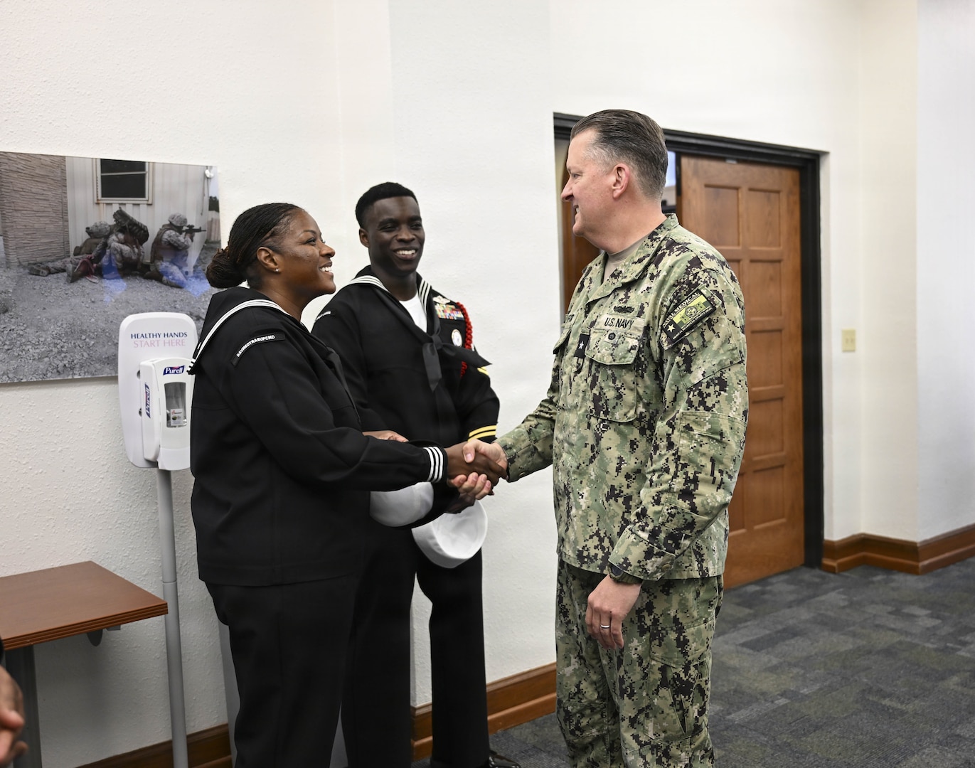 Rear Adm. Walter Brafford, commander, Naval Medical Forces Development Command, greets region Sailor of the Year finalists, March 24, 2026. (U.S. Navy photo by Mass Communication Specialist 1st Class Shayla D. Hamilton)