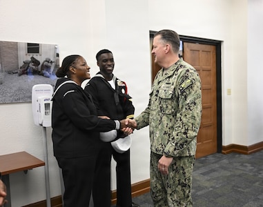 Rear Adm. Walter Brafford, commander, Naval Medical Forces Development Command, greets region Sailor of the Year finalists, March 24, 2026. (U.S. Navy photo by Mass Communication Specialist 1st Class Shayla D. Hamilton)