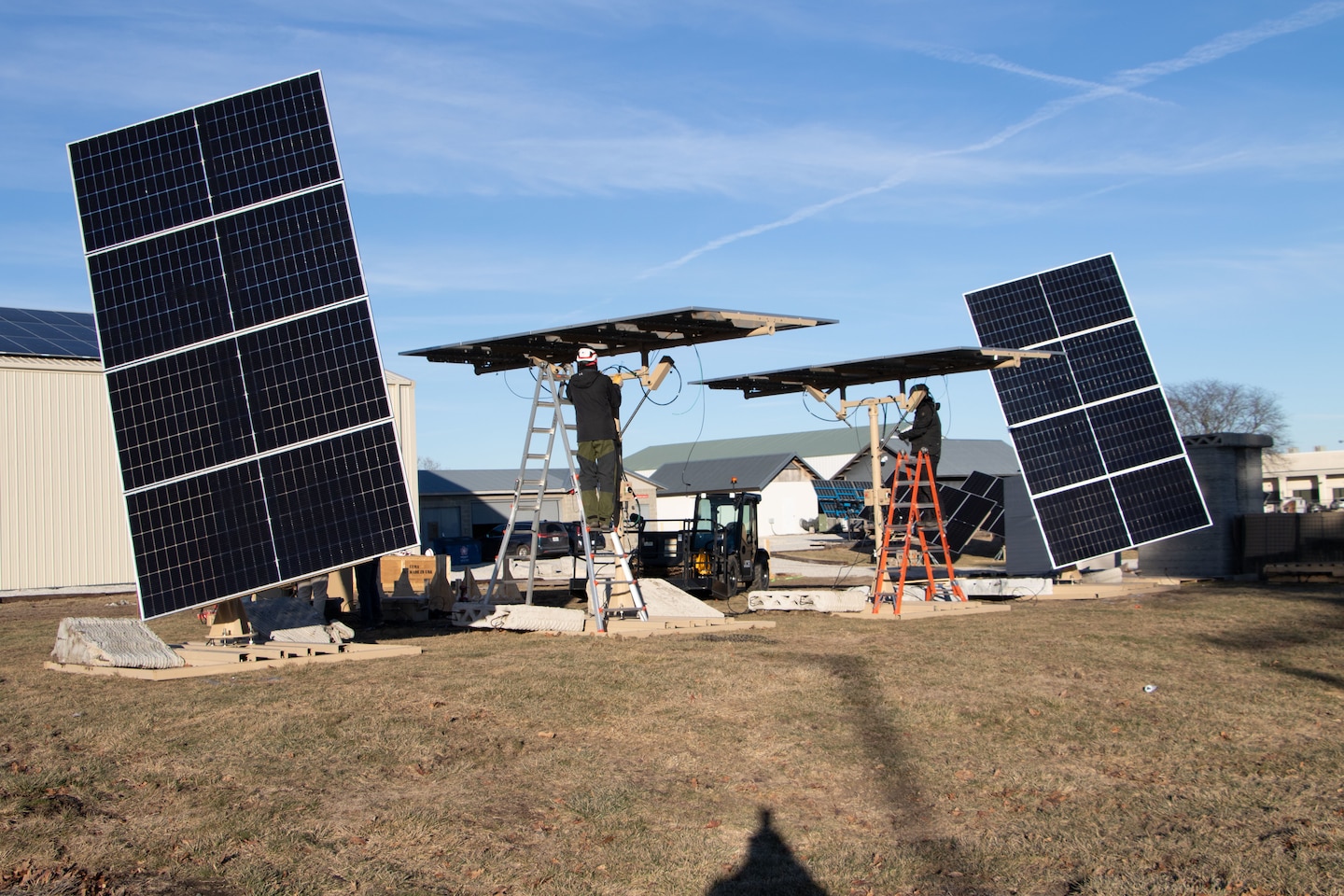 Researchers from the U.S. Army Engineer Research Development Center’s (ERDC) Construction Engineering Research Laboratory (CERL) and technicians from industry partner, LEMA, install a system of four LEMA photovoltaic panels at the ERDC Forward Operating Base Laboratory in Champaign, Illinois.
