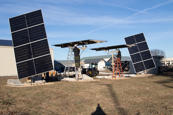 Researchers from the U.S. Army Engineer Research Development Center’s (ERDC) Construction Engineering Research Laboratory (CERL) and technicians from industry partner, LEMA, install a system of four LEMA photovoltaic panels at the ERDC Forward Operating Base Laboratory in Champaign, Illinois.