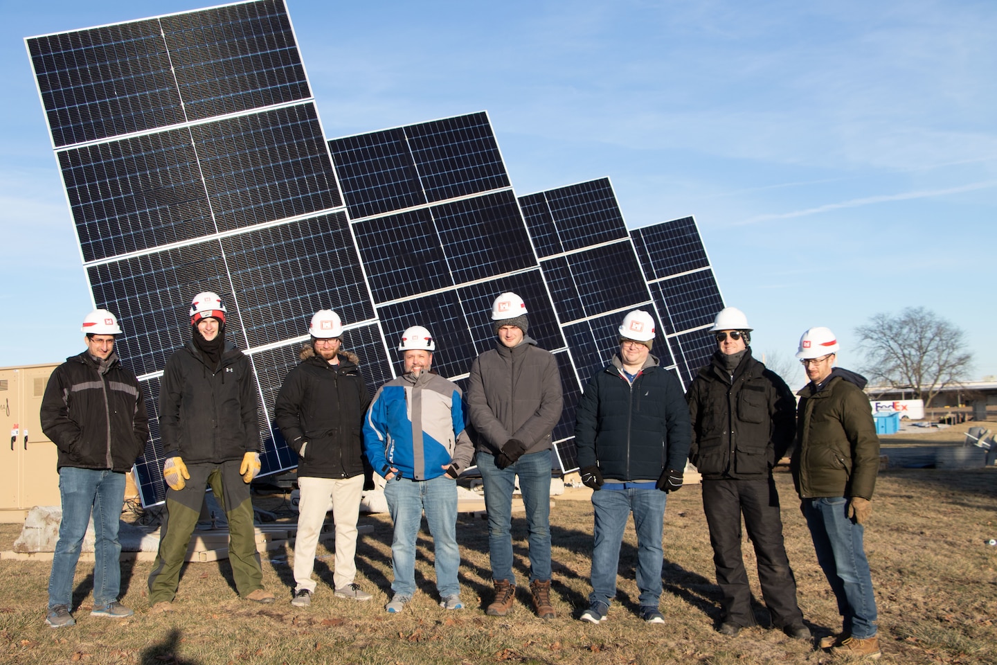 Researchers from the U.S. Army Engineer Research Development Center’s (ERDC) Construction Engineering Research Laboratory (CERL) and key team members from industry partner, LEMA, in front of a just installed system of four LEMA photovoltaic panels at the ERDC Forward Operating Base Laboratory in Champaign, Illinois.
