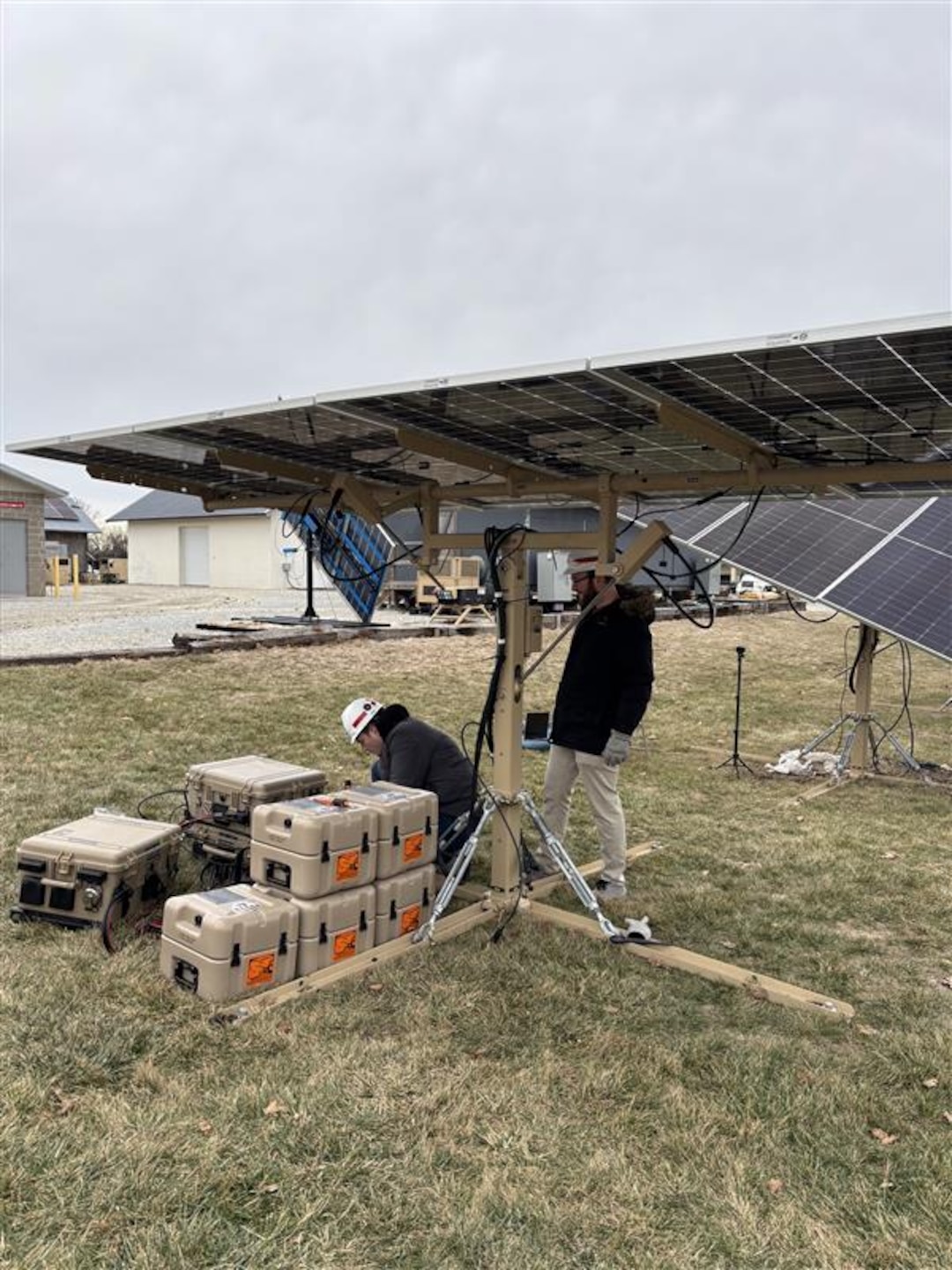Researchers from the U.S. Army Engineer Research Development Center’s (ERDC) Construction Engineering Research Laboratory (CERL) install a LEMA single photovoltaic panel at the ERDC Forward Operating Base Laboratory in Champaign, Illinois.