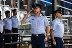 U.S. Air Force Col. Richard K. Kind, left, 97th Air Mobility Wing Commander, and Chief Master Sgt. Jon T. Adams, right, 97th Air AMW command chief, render honors during a 737th Training Group’s Basic Military Training graduation parade, at Joint Base San Antonio-Lackland, Texas, April 2, 2026. The ceremony is one of three graduation events for the Department of the Air Force Basic Military Training and signifies the transition from trainee to Airman. The 37th Training Wing, known as “Gateway to the Air Force,” is home to BMT. (U.S. Air Force photo by Ismael Ortega)