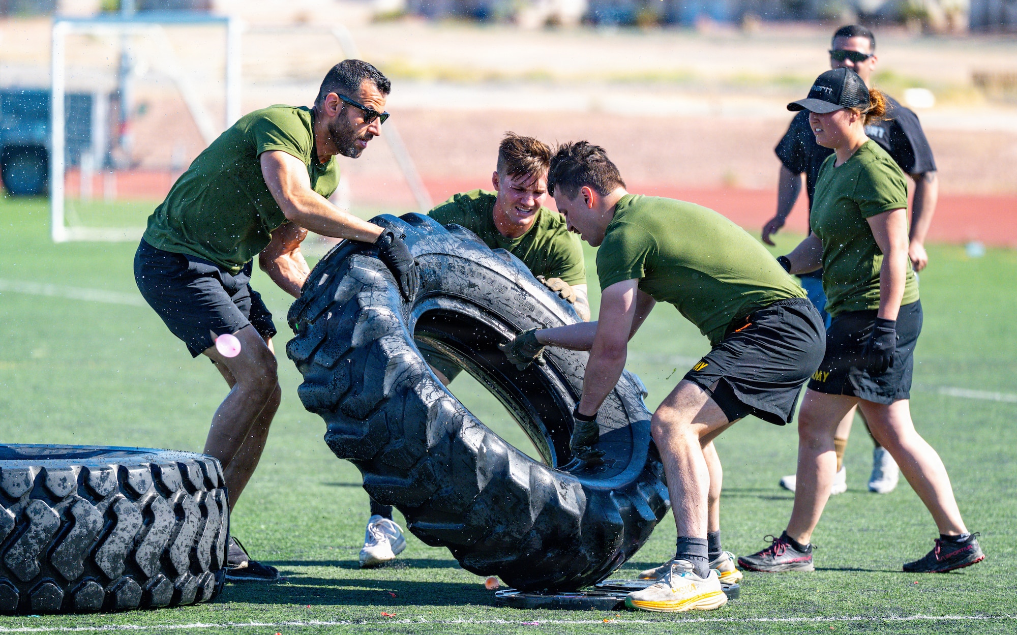 People moving tire