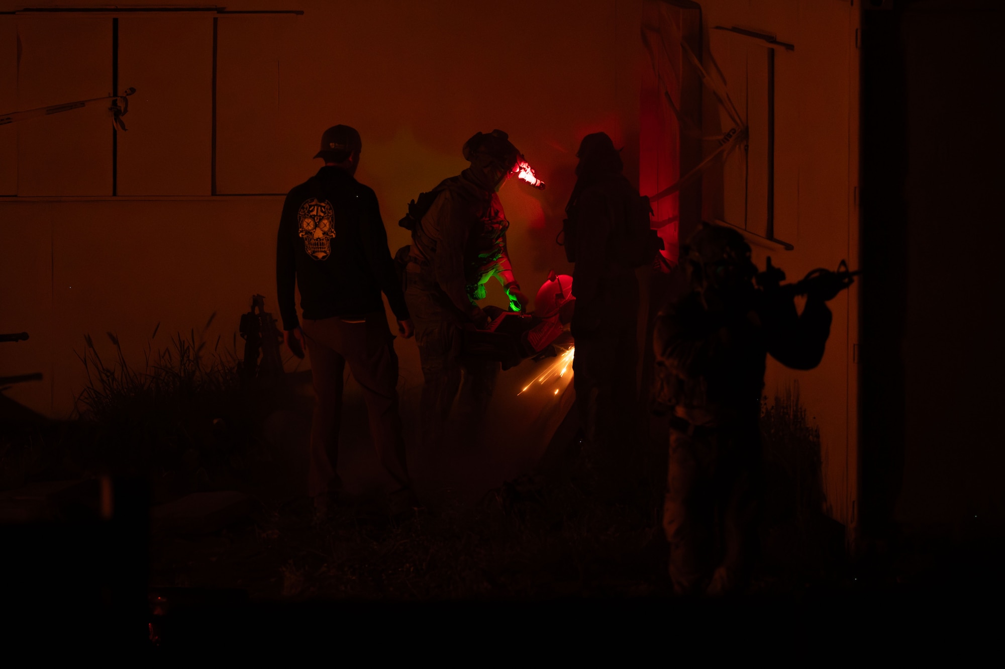 U.S. Air Force pararescuemen assigned to the 68th Rescue Squadron cut down a concrete barrier during the Combat Leader Course at Davis-Monthan Air Force Base, Arizona, April 10, 2026. The pararescuemen breached the barrier to access a simulated collapsed structure and recover casualties during the scenario. (U.S. Air Force photo by Airman 1st Class Jaden Kidd)