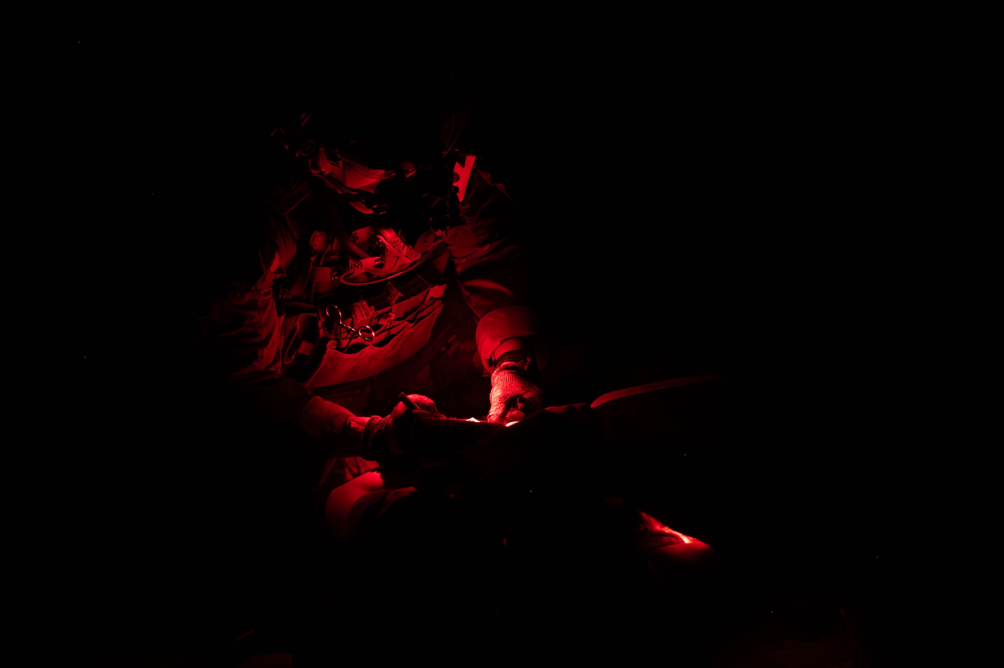 A U.S. Air Force pararescueman assigned to the 68th Rescue Squadron provides medical care to a simulated casualty during the Combat Leader Course at Davis-Monthan Air Force Base, Arizona, April 10, 2026. The exercise required Airmen to locate, treat and evacuate casualties while operating in a contested environment. (U.S. Air Force photo by Airman 1st Class Jaden Kidd)