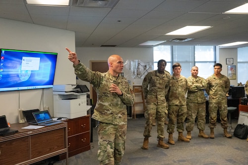 U.S. Air Force Lt. Col. Alan Geason, 17th Communications Squadron commander, briefs the honorary commanders during the 17th Mission Support Group immersion at Goodfellow Air Force Base, Texas, April 9, 2026. The briefing highlighted communications capabilities that support installation operations. (U.S. Air Force photo by Senior Airman James Salellas)