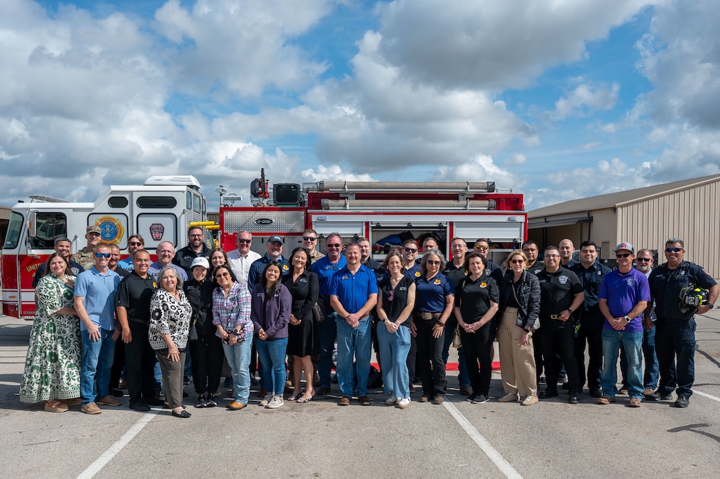 Honorary commanders pose for a photo in front of a fire department vehicle following a tour of the 17th Civil Engineer Squadron during the 17th Mission Support Group immersion at Goodfellow Air Force Base, Texas, April 9, 2026. The visit highlighted emergency response capabilities and infrastructure support across the installation. (U.S. Air Force photo by Senior Airman James Salellas)
