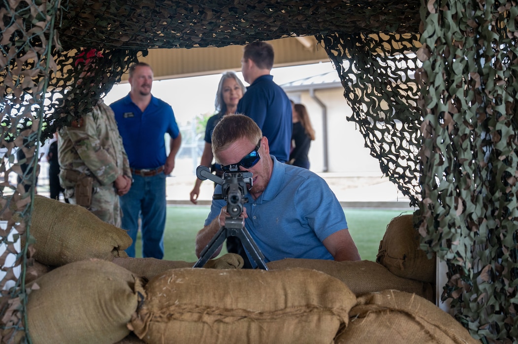 Tom Greene County Judge Lane Carter, honorary commander, engages in a weapons demonstration during the 17th Mission Support Group immersion at Goodfellow Air Force Base, Texas, April 9, 2026. The immersion included hands-on experiences with Security Forces equipment and training. (U.S. Air Force photo by Senior Airman James Salellas)