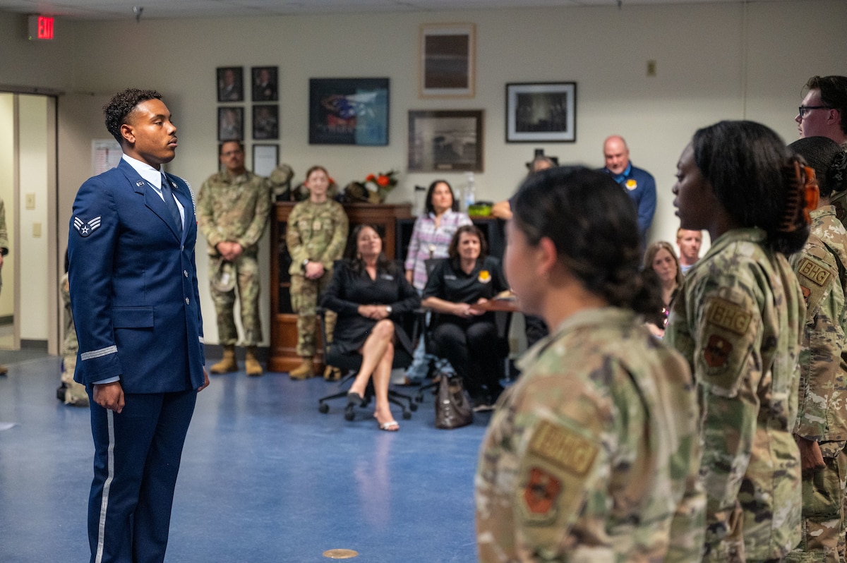 U.S. Air Force Honor Guard members demonstrate ceremonial procedures for honorary commanders during the 17th Mission Support Group immersion at Goodfellow Air Force Base, Texas, April 9, 2026. The demonstration highlighted the precision and discipline required to render military honors. (U.S. Air Force photo by Senior Airman James Salellas)