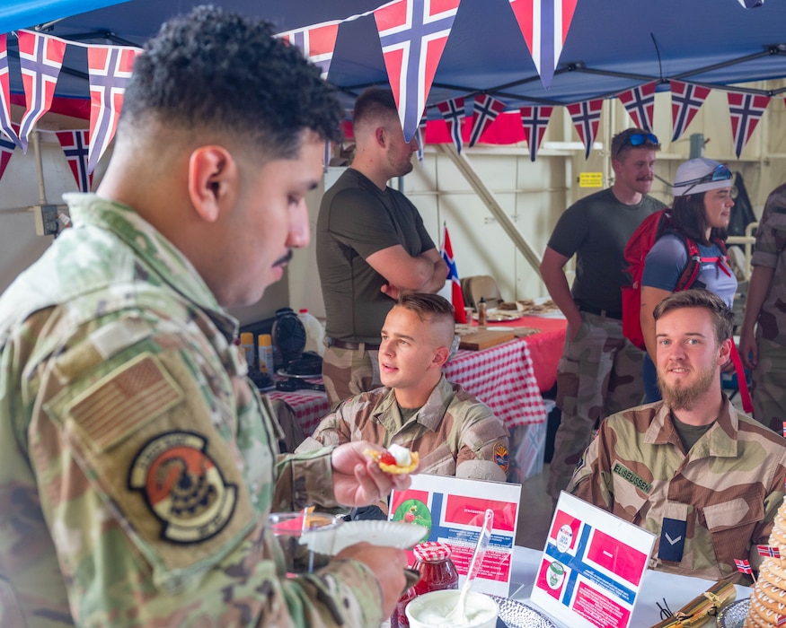 U.S. Air Force Airmen assigned to the 56th Fighter Win eats Norwegian dish during International Day 2026, April 10, 2026, at Luke Air Force Base, Arizona.