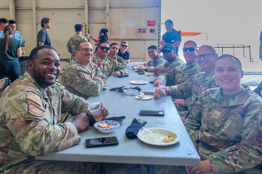 U.S. Air Force Airmen assigned to the 56th Fighter Wing pose for a photo during International Day 2026, April 10, 2026, at Luke Air Force Base, Arizona.