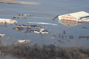 Aerial photo showing one-third of Offutt Air Force Base, Nebraska, covered by floodwaters