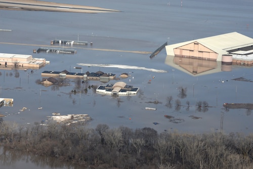 Aerial photo showing one-third of Offutt Air Force Base, Nebraska, covered by floodwaters