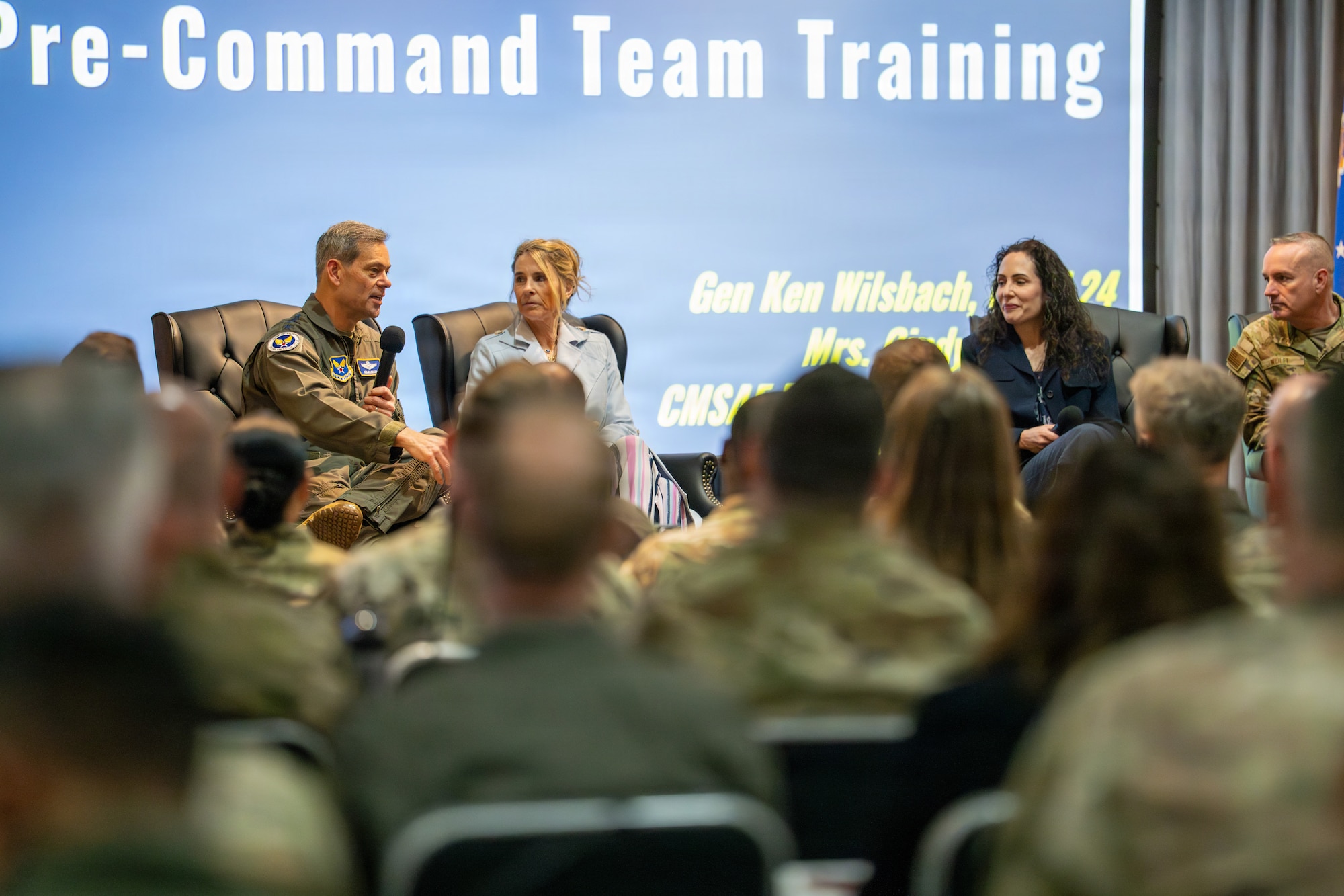 Gen. Ken Wilsbach, Air Force Chief of Staff, left, speaks during a panel discussion with his wife, Cindy Wilsbach, at Air University’s Pre-Command Team Training at Maxwell Air Force Base, Alabama, April 9, 2026.