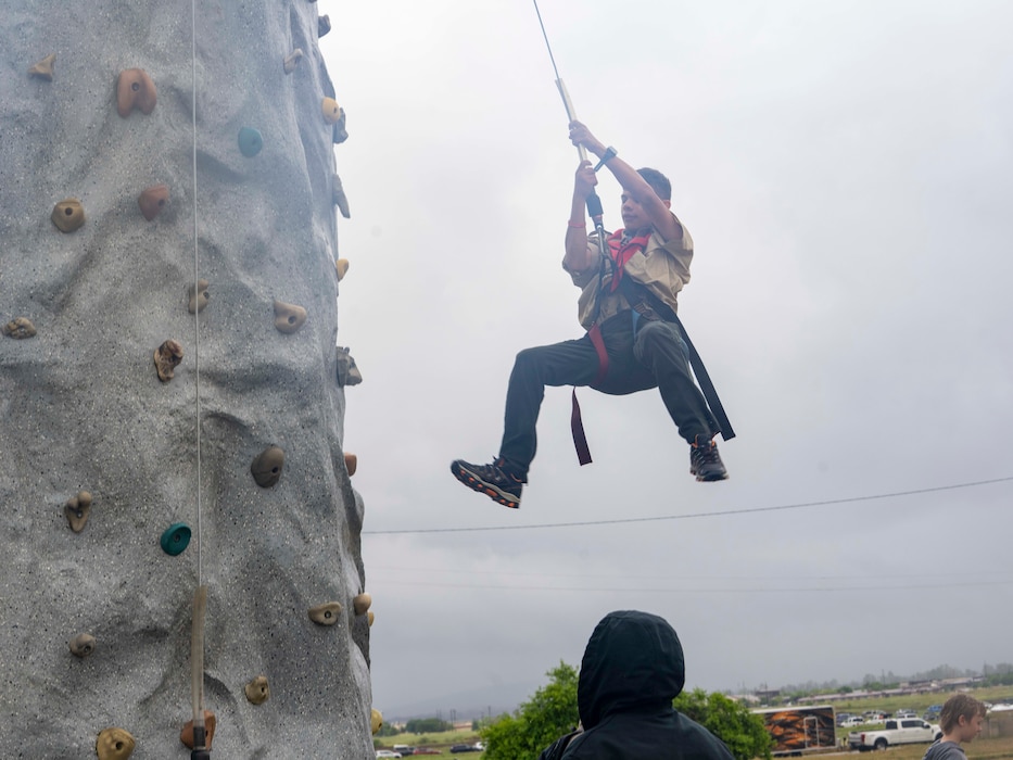 A Scout rappels down a rock wall during the 2026 Scout Expo at Beale Air Force Base, California, April 11, 2026.