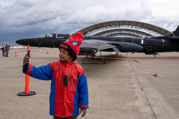 A Scout Expo attendee takes a selfie with the U-2 Dragon Lady at Beale Air Force Base, California, on April 11, 2026.