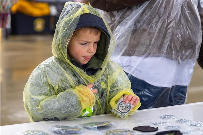 A Scout considers memorabilia offered at the 2026 Scout Expo at Beale Air Force Base, California, April 11, 2026.
