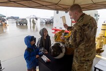 U.S. Air Force Staff Sgt. Adam Dzekunskas, 9th Physiological Support Squadron aerospace physiology technician, demonstrates how a U-2 Dragon Lady pilot would drink while in their high-altitude pressure suit for Scouts during the 2026 Scout Expo at Beale Air Force Base, California, April 11, 2026.