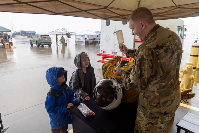 U.S. Air Force Staff Sgt. Adam Dzekunskas, 9th Physiological Support Squadron aerospace physiology technician, demonstrates how a U-2 Dragon Lady pilot would drink while in their high-altitude pressure suit for Scouts during the 2026 Scout Expo at Beale Air Force Base, California, April 11, 2026.