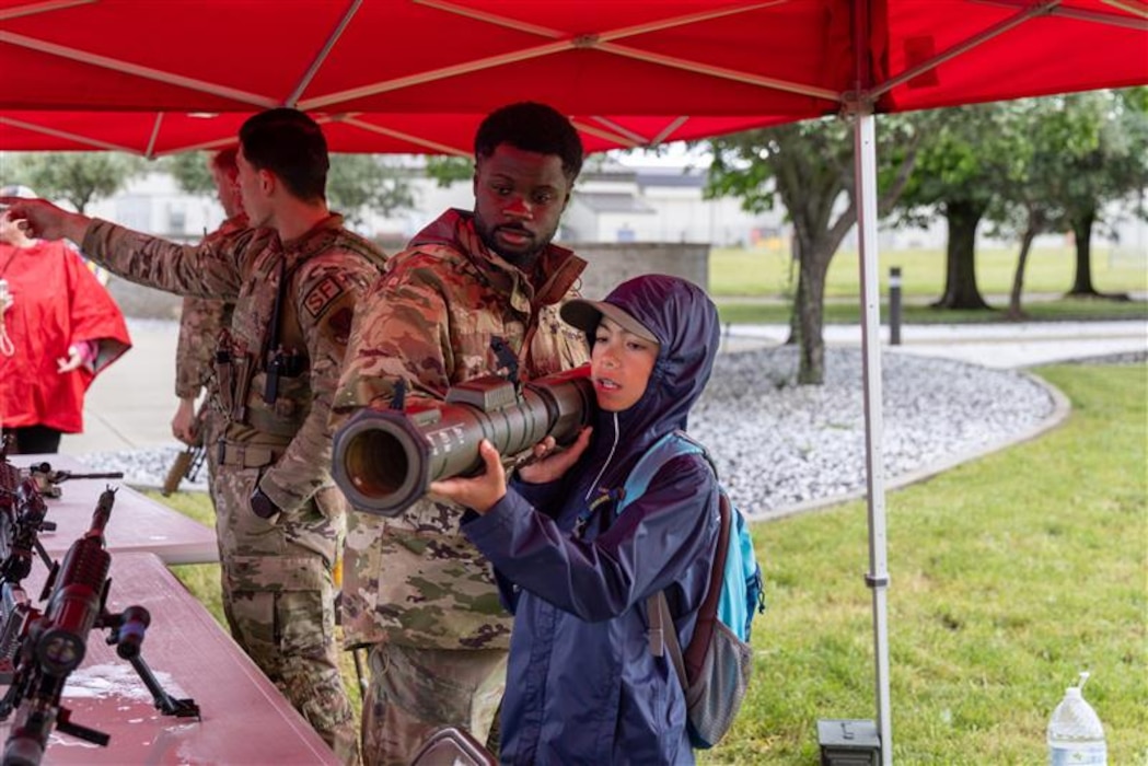 U.S. Air Force Senior Airman Fordje Obro-Ababio, 9th Security Forces Squadron combat arms instructor, teaches a Scout how to hold an M136 AT4 light anti-armor weapon during the 2026 Scout Expo at Beale Air Force Base, California, April 11, 2026.