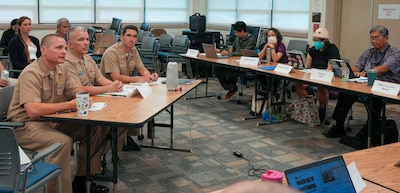 Cmdr. Benjamin Dunn, left, deputy for environment and remediation, Navy Closure Task Force-Red Hill (NCTF-RH) provides a progress update at the Hawaii Department of Health Fuel Tank Advisory Committee meeting in Honolulu, April 9, 2026. Charged with the safe decommissioning of the Red Hill Bulk Fuel Storage Facility (RHBFSF), NCTF-RH was established by the Department of the Navy as a commitment to the community and the environment. NCTF-RH continues to engage with the people of Hawaii, regulatory agencies, and other stakeholders as it safely and deliberately decommissions the RHBFSF. (U.S. Navy photo by Mass Communication Specialist 1st Class Glenn Slaughter)