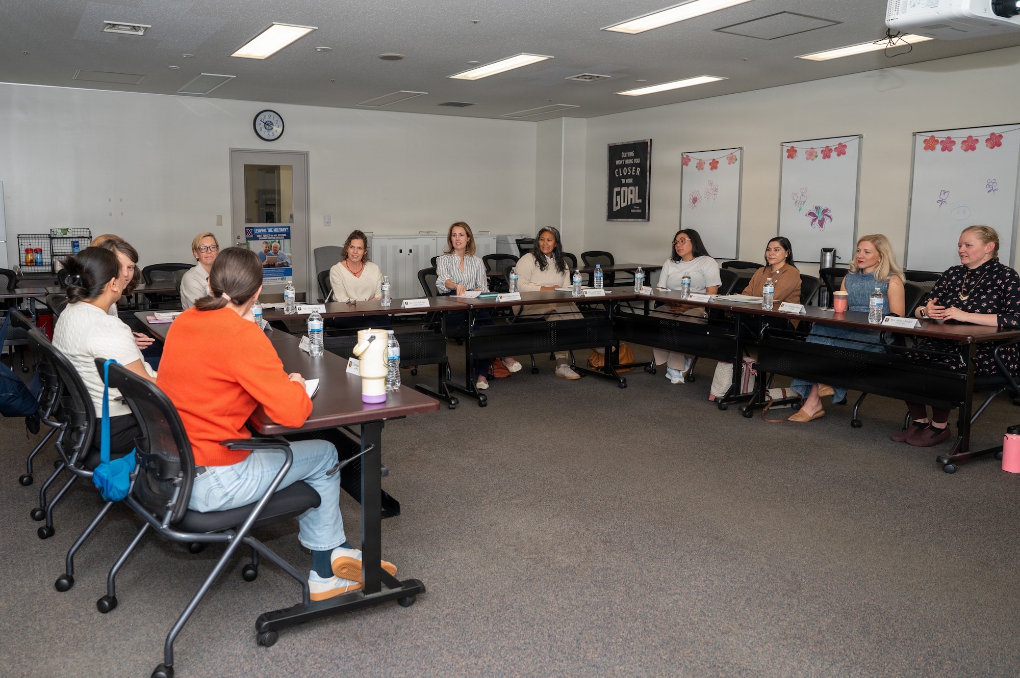 Mendy Carey (center left) sits with members from the 35th Fighter Wing Key Support Liaison group to discuss quality of life.