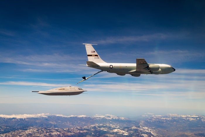 A U.S. Air Force B-21 Raider conducts aerial refueling with a KC-135 Stratotanker. This is a key part of a rigorous test campaign to mature the systems required for survivable, long-range, penetrating strike. The ability to refuel in-flight is fundamental to the Raider’s role in projecting power globally and provides combatant commanders with the flexible options needed to deliver decisive effects anywhere in the world. (U.S. Air Force photo)