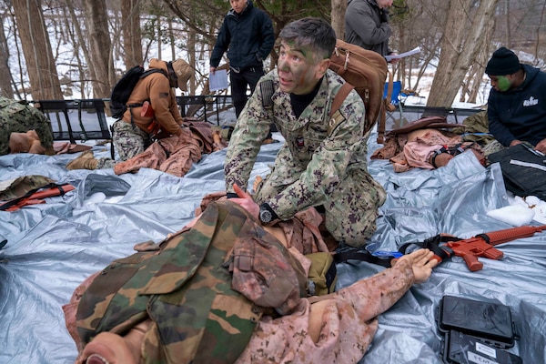 260212-N-JC800-1005 BETHESDA, Md. (Feb. 12, 2026) - Hospital Corpsman 2nd Class Richard Blair, assigned to the Naval Postgraduate Dental school at Naval Medical Leader and Professional Development, performs check on a maniquien during a final exercise as part of the Tactical Combat Casualty Course. (U.S. Navy Photo by Mass Communication Specialist 1st Class Heath Zeigler/Released)