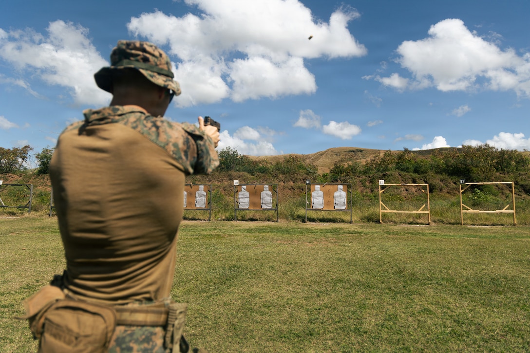 A U.S. Marine Corps rifleman with India Company, Battalion Landing Team 3/6, 22nd Marine Expeditionary Unit (Special Operations Capable), fires an M18 pistol during a qualification live-fire range at Camp Santiago, Puerto Rico, March 31, 2025. U.S. military forces are deployed to the Caribbean in support of the U.S. Southern Command mission, Department of War-directed operations, and the president’s priorities to disrupt illicit drug trafficking and protect the homeland. (U.S. Marine Corps photo)