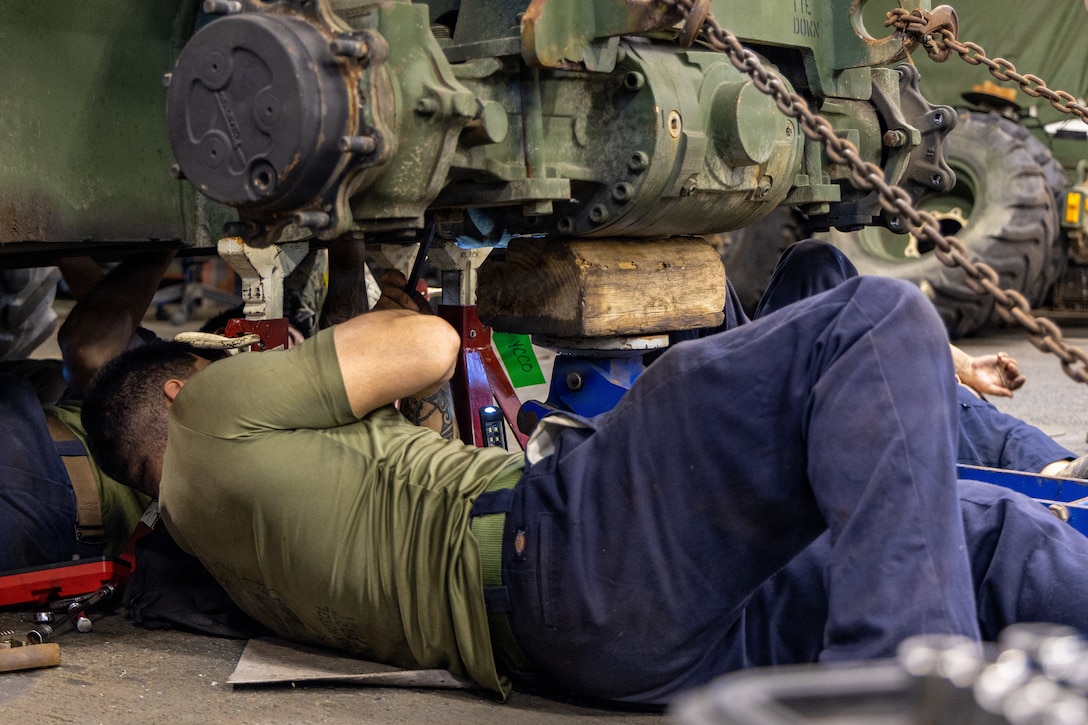 A U.S. Marine with Combat Logistics Battalion 26, 22nd Marine Expeditionary Unit (Special Operations Capable), conducts maintenance on an extended boom forklift aboard Wasp-class amphibious assault ship USS Iwo Jima (LHD 7) while underway in the Caribbean Sea, April 3, 2026. U.S. military forces are deployed to the Caribbean in support of the U.S. Southern Command mission, Department of War-directed operations, and the president’s priorities to disrupt illicit drug trafficking and protect the homeland. (U.S. Marine Corps photo)