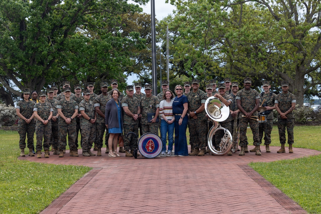 U.S. Marine Corps. Maj. Gen. Farrell Sullivan, commanding general, and Col. David Ickles, chief of staff, both with 2nd Marine Division, pose with Marines and family on Marine Corps Base Camp Lejeune, North Carolina, April 7, 2026. Ickles received the Defense Meritorious Service Medal for his role as the commander of the Joint Task Force southern guard in support of the department of homeland security. (U.S. Marine Corps photo by Lance Cpl. Carla Perez Ramirez)
