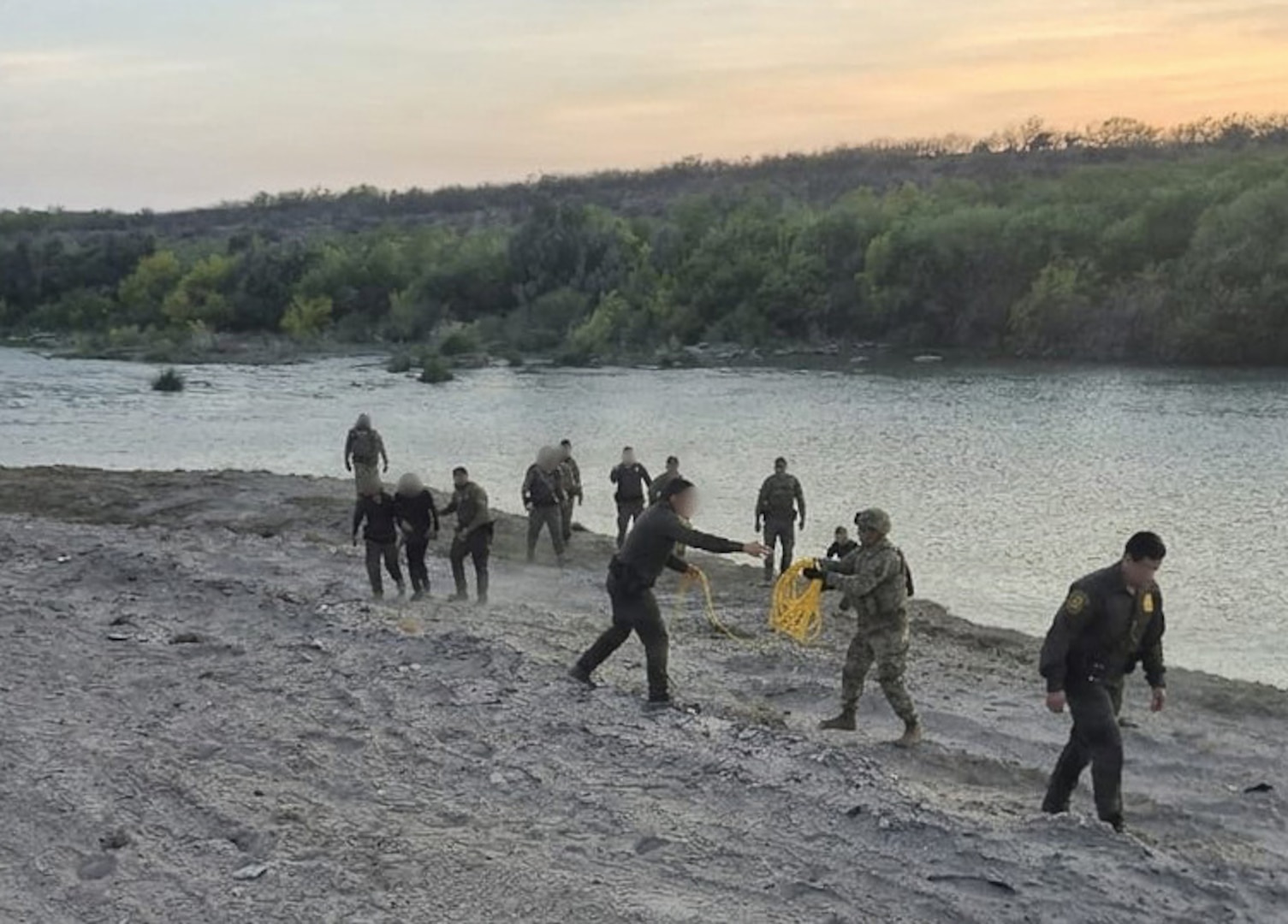 U.S. Border Patrol agents, Texas state troopers and U.S. Army Soldiers assigned to Joint Task Force-Southern Border rescue three illegal aliens attempting to cross the U.S. southern border near Laredo, Texas, April 1, 2026.