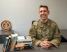 Master Sgt. Frank Chappell, religious affairs superintendent, 171st Air Refueling Wing, poses for a photo with books from the Little Free Library in the Resiliency Center, April 6, 2026, near Pittsburgh. Chappell initially received over 30 boxes of books from Operation Paperback, a non-profit organization that collects gently used books from volunteers and ships them to American troops, military families, and veterans. (U.S. Air National Guard photo by Airman 1st Class Natalie Claypoole)