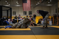 U.S. Army National Guard Soldiers representing Pennsylvania, Ohio, Nevada, Guam, and the District of Columbia compete during day two of the 2026 Lacerda Cup All-Army Combatives Championship at Fort Benning, Ga. Apr. 9, 2026. Fighters progress through the quarterfinals and semifinals to earn their championship cage match bouts. The competition features eight-person teams and individual Soldiers performing multiple close-quarters combatives techniques, proving their readiness to close with and destroy the enemy in hand-to-hand combat.