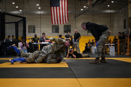 U.S. Army National Guard Soldiers representing Pennsylvania, Ohio, Nevada, Guam, and the District of Columbia compete during day two of the 2026 Lacerda Cup All-Army Combatives Championship at Fort Benning, Ga. Apr. 9, 2026. Fighters progress through the quarterfinals and semifinals to earn their championship cage match bouts. The competition features eight-person teams and individual Soldiers performing multiple close-quarters combatives techniques, proving their readiness to close with and destroy the enemy in hand-to-hand combat.