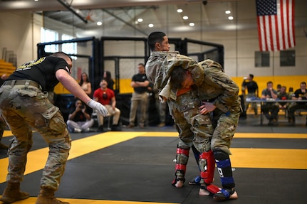 U.S. Army National Guard Soldiers representing Pennsylvania, Ohio, Nevada, Guam, and the District of Columbia compete during day two of the 2026 Lacerda Cup All-Army Combatives Championship at Fort Benning, Ga. Apr. 9, 2026. Fighters progress through the quarterfinals and semifinals to earn their championship cage match bouts. The competition features eight-person teams and individual Soldiers performing multiple close-quarters combatives techniques, proving their readiness to close with and destroy the enemy in hand-to-hand combat.