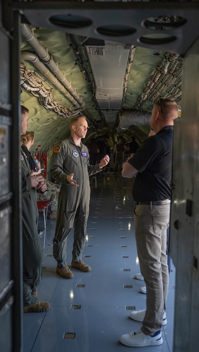 U.S. Air Force Lt. Col. Aaron Brown, 54th Air Refueling Squadron commander, talks with Air Mobility Command civic leaders inside a U.S. Air Force KC-135 Stratotanker aircraft at Altus Air Force Base (AFB), Oklahoma, April 9, 2026. Senior leaders and civic leaders from Air Mobility Command gained a firsthand look at how Altus develops the next generation of KC-135 aircrew. (U.S. Air Force photo by Airman 1st Class Emma Wright)