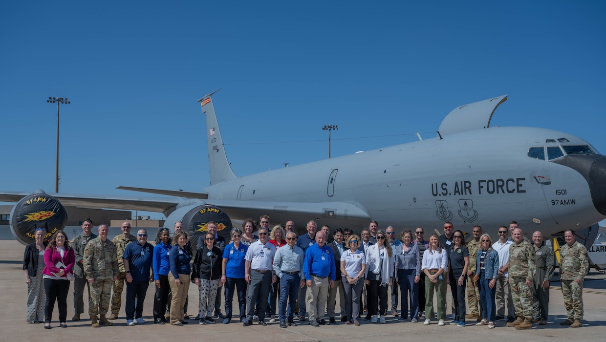 Air Mobility Command (AMC) senior and civic leaders and Altus leadership pose in front of a U.S. Air Force KC-135 Stratotanker aircraft static display at Altus Air Force Base (AFB), Oklahoma, April 9, 2026. Altus AFB hosted AMC civic and senior leaders for an immersive visit focused on engaging with the Airmen who power the mission. (U.S. Air Force photo by Airman 1st Class Emma Wright)