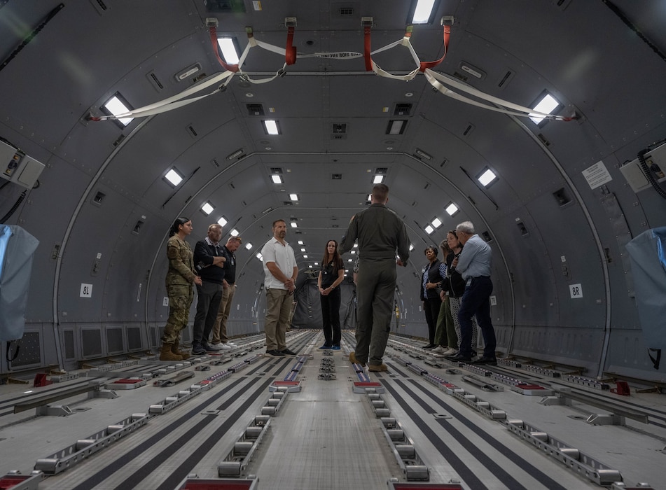 Air Mobility Command (AMC) senior leaders and civic leaders stand in the back of a U.S. Air Force KC-46 Pegasus aircraft at Altus Air Force Base (AFB), Oklahoma, April 9, 2026. AMC leaders learned about the aircraft as well as how training is conducted for the KC-46 at Altus AFB. (U.S. Air Force photo by Airman 1st Class Emma Wright)