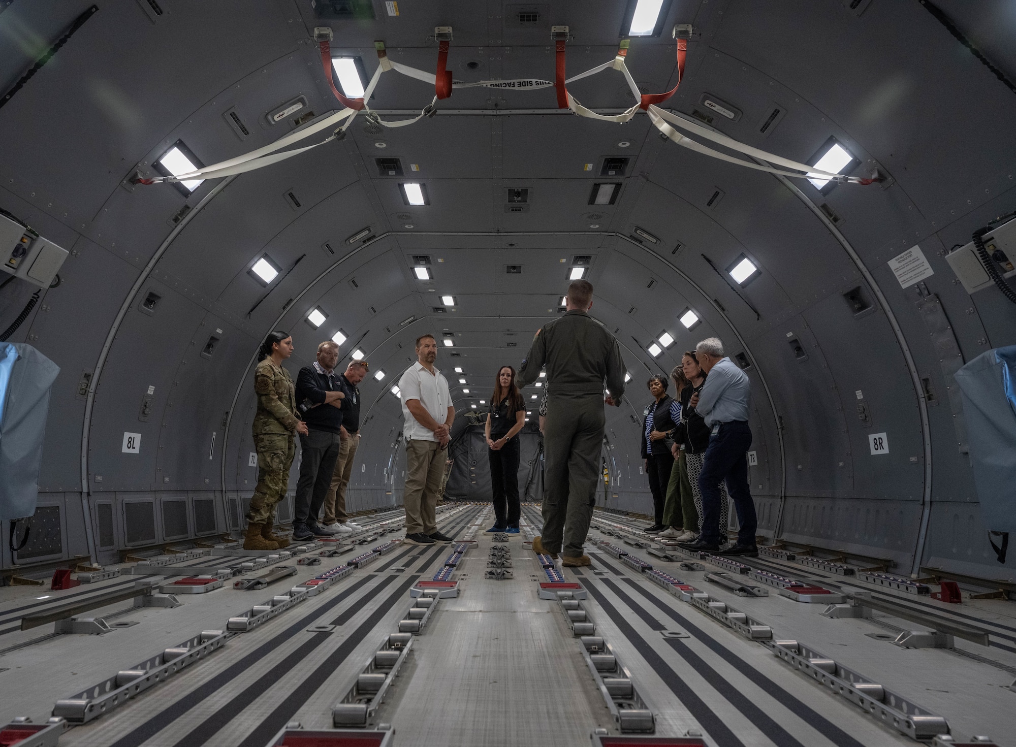 Air Mobility Command (AMC) senior leaders and civic leaders stand in the back of a U.S. Air Force KC-46 Pegasus aircraft at Altus Air Force Base (AFB), Oklahoma, April 9, 2026. AMC leaders learned about the aircraft as well as how training is conducted for the KC-46 at Altus AFB. (U.S. Air Force photo by Airman 1st Class Emma Wright)