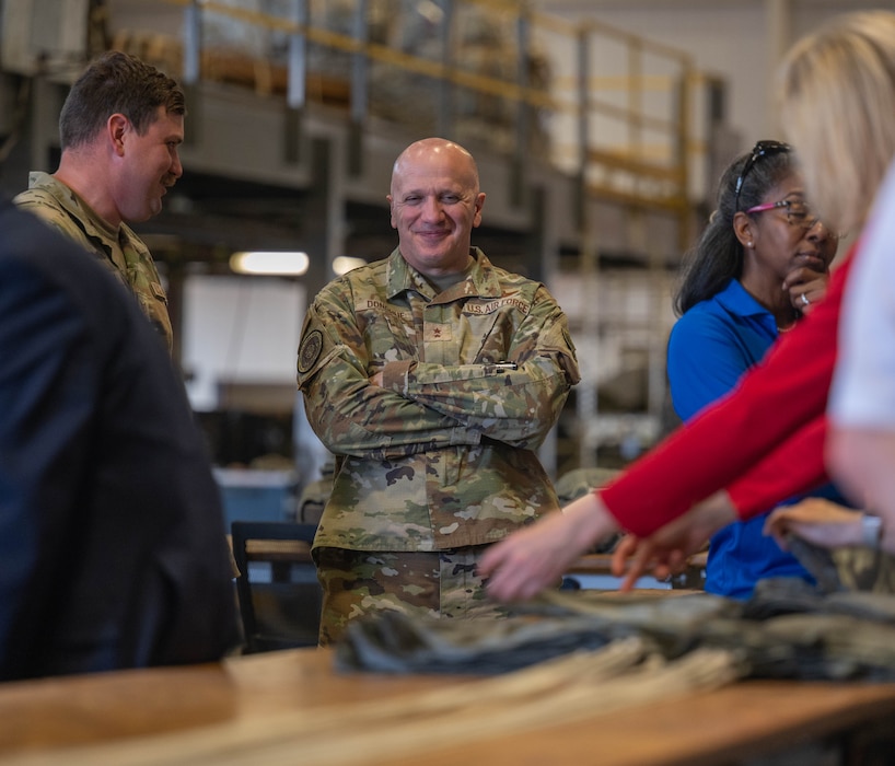 U.S. Air Force Maj. Gen. Gerald Donohue, Interim Air Mobility Command (AMC) deputy commander, views an interactive parachute building demonstration at Altus Air Force Base, Oklahoma, April 9, 2026. The visit from AMC senior leaders and civic leaders reinforced the strong partnership between Altus and AMC. (U.S. Air Force photo by Airman 1st Class Emma Wright)