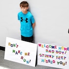 Eleven-year-old Isaac, a friend of Illinois Army National Guard Capt. Tucker Petersen, waits for the captain to arrive at the University of Illinois Willard Airport