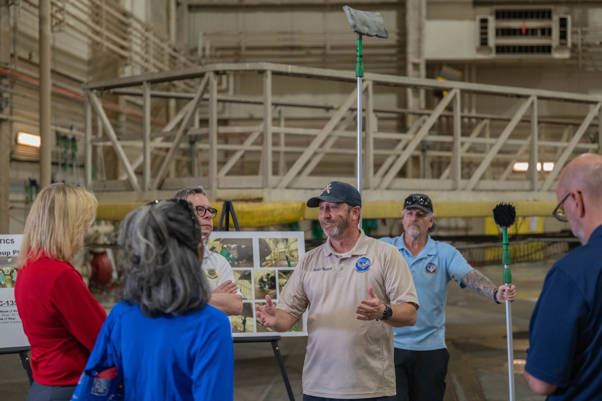 Scott Weaver, 97th Maintenance Squadron corrosion section chief, addresses Air Mobility Command (AMC) civic leaders at Altus Air Force Base, Oklahoma, April 9, 2026. AMC senior leaders and civic leaders had the opportunity to learn about the mission-critical work of the 97th Maintenance Squadron in maintaining the U.S. Air Force C-17 Globemaster III aircraft, KC-46 Pegasus aircraft, and KC-135 Stratotanker aircraft. (U.S. Air Force photo by Airman 1st Class Emma Wright)
